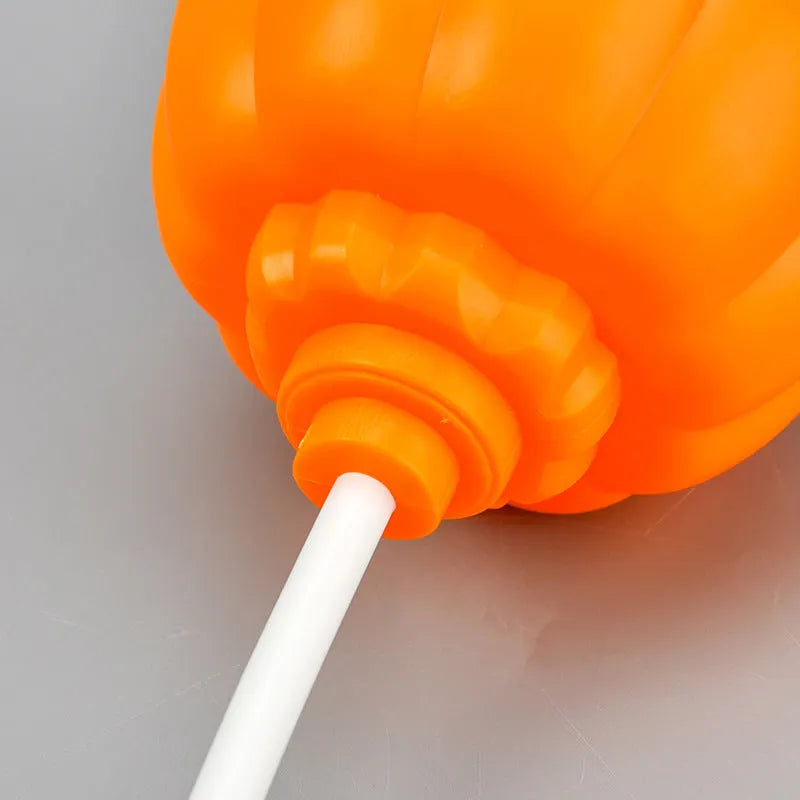 USB rechargeable plastic pumpkin lamp with purple or yellow LED lighting measuring 8.3cm diameter
