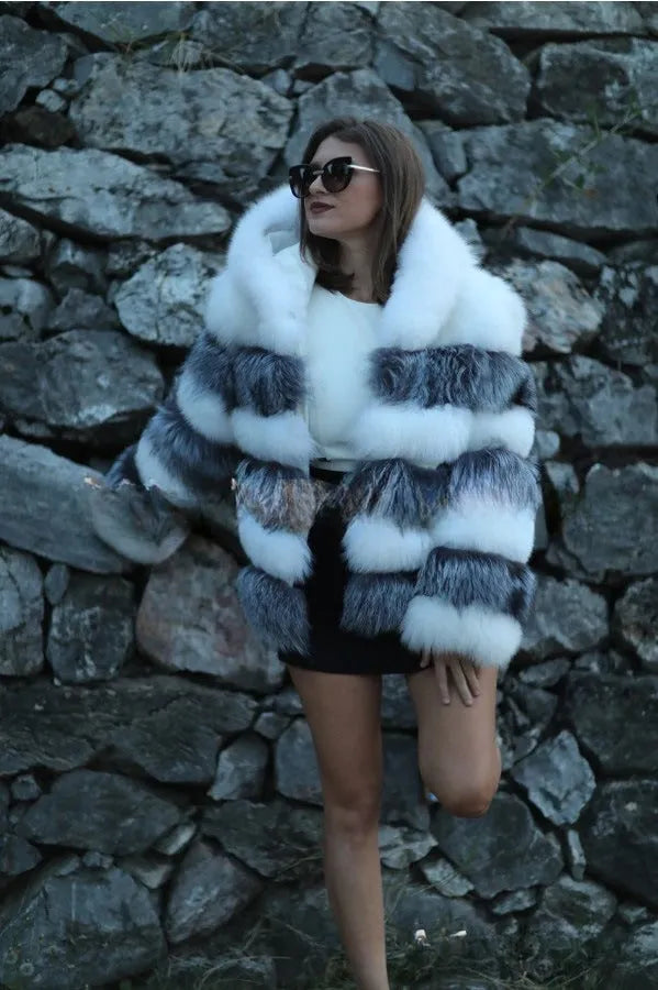 Women's loose artificial fur coat with detachable hood in street fashion style.