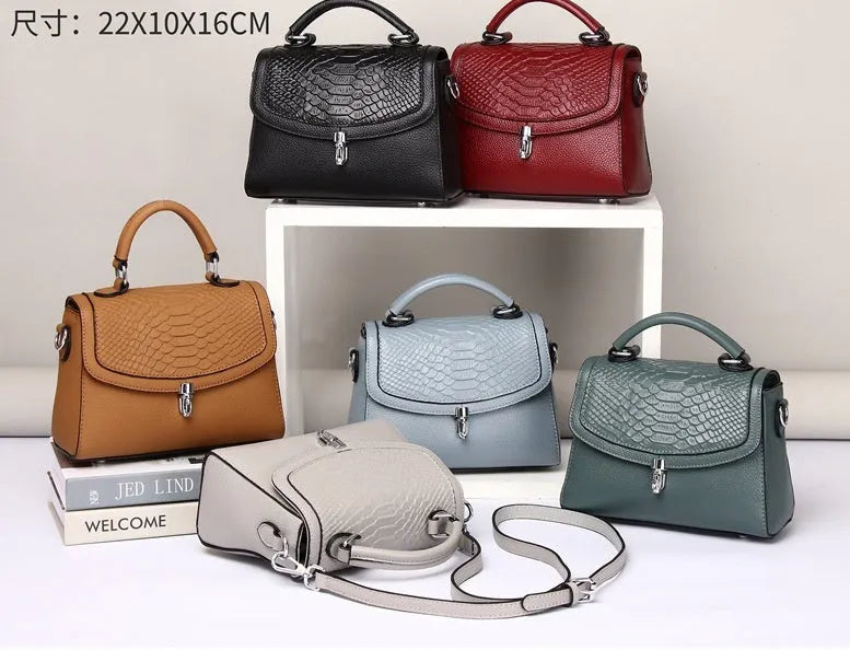 Real leather cross-body bag in head layer cowhide with crocodile print, small square shape, lock opening, blue or brown.