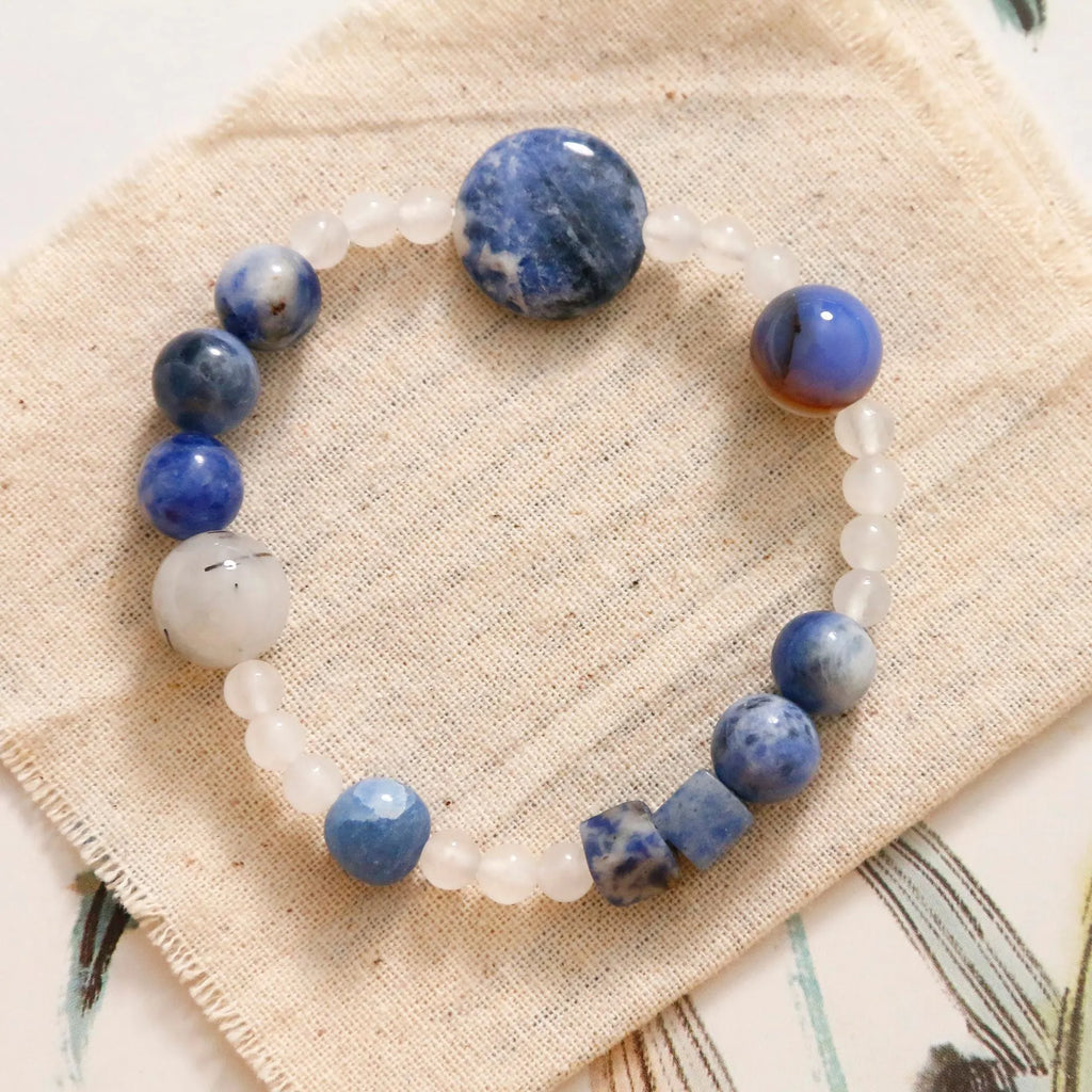 Hand-woven natural blue point stone and black hair crystal agate bracelet with geometric design