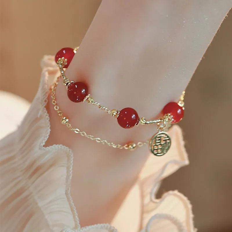 Red agate and alloy double-layer women's bracelet with Hongma lucky charm pendant on wrist