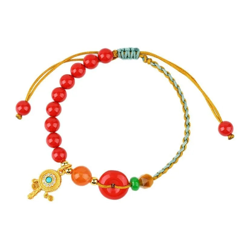 Red cinnabar bracelet with geometric patterns and peace buckle closure