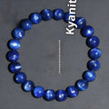 A polished blue crystal bracelet with geometry-shaped beads and a Ruyi charm on a single circle.