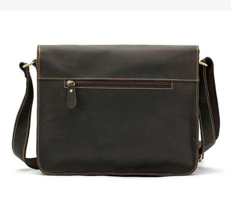 Brown genuine leather vintage messenger bag with adjustable strap, shown open to reveal internal zippered and padded pockets.