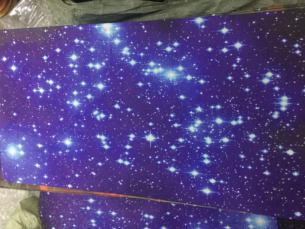 Blue star mouse pad with high-density fabric surface and anti-skid natural rubber base on a desk