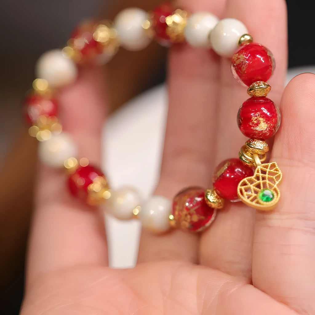 Women's ethnic geometric bracelet with gold foil decoration on glass and coloured glaze in two colour options.