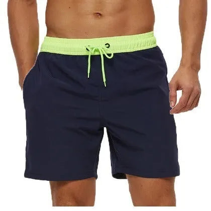 Men's blue athletic shorts with a drawstring waist and a visible zippered pocket on the hip.