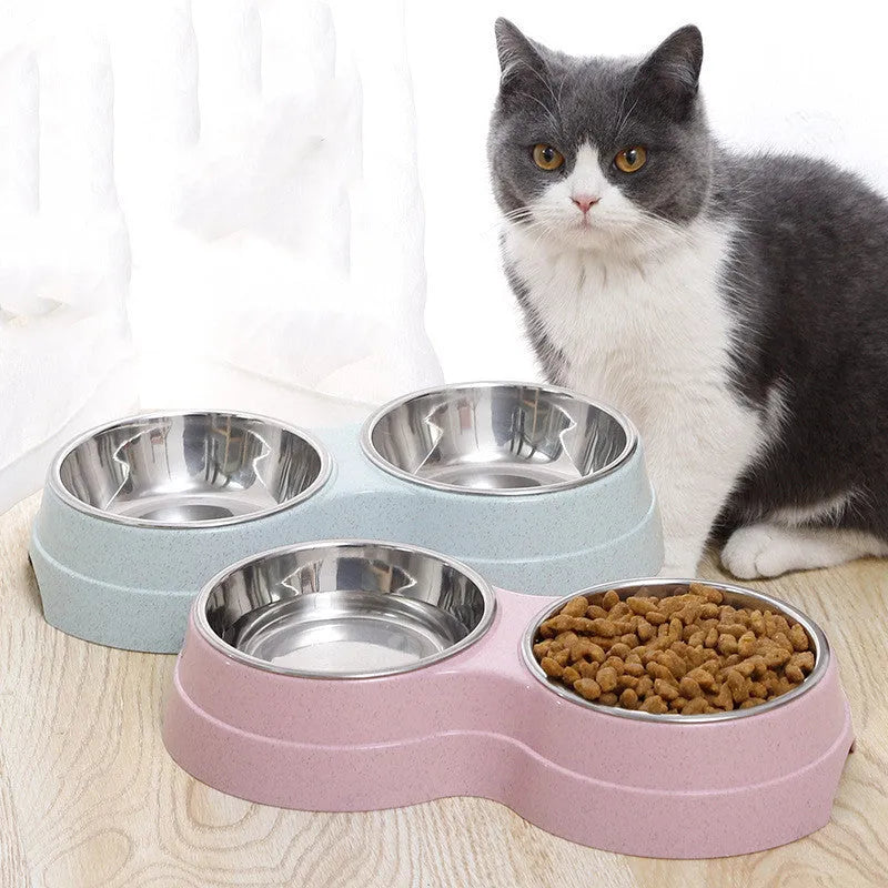 Round two-in-one dog bowl with straw in blue, green, and pink colours measuring 24.5 x 13.5 x 4.6 cm