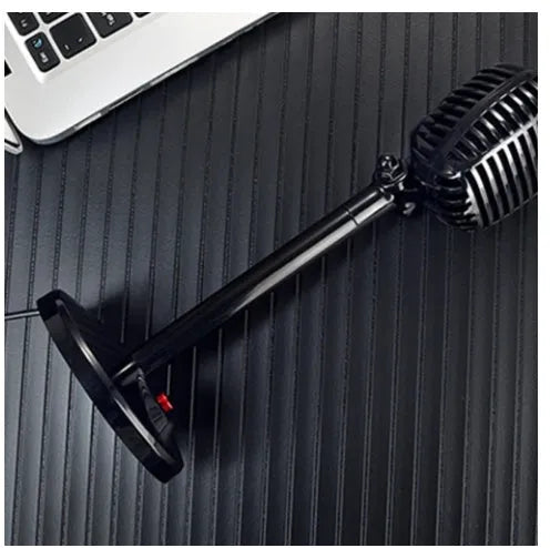 Black USB computer microphone with adjustable neck stand on desktop