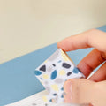 A brick-shaped, single-piece rubber eraser for traceless pencil and charcoal mark removal