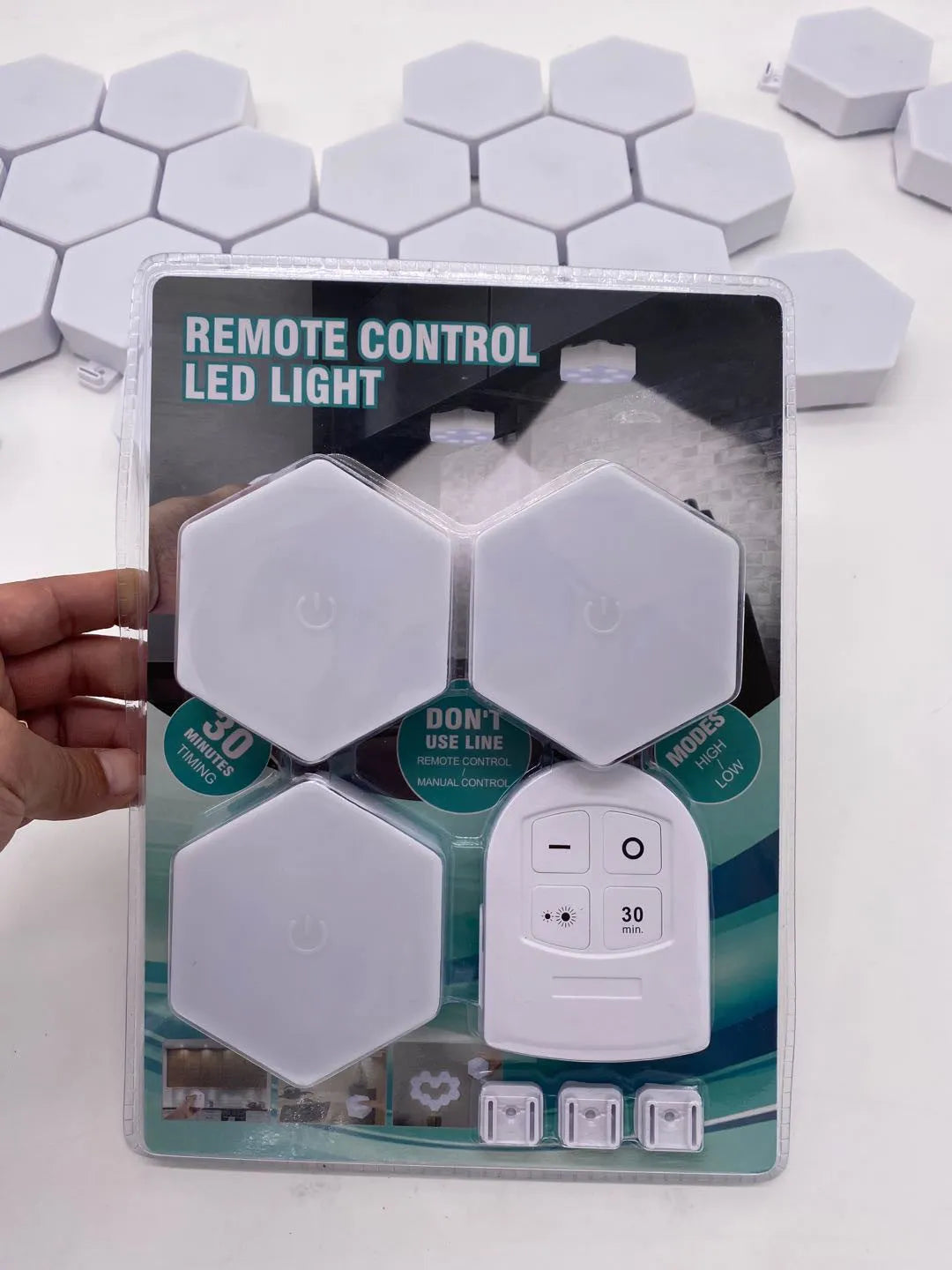 White rectangular remote control touch light with LED patches and separate handheld remote