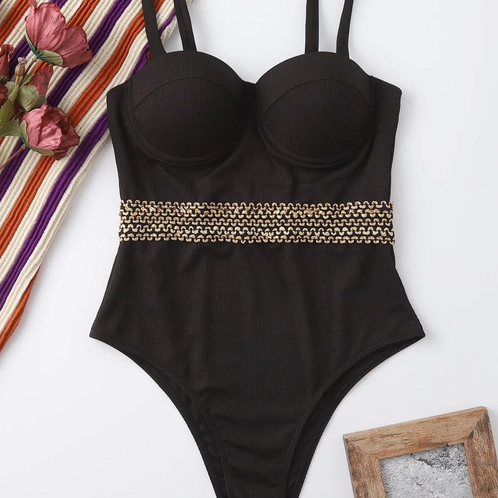 Black women's one-piece swimsuit with adjustable shoulder strap on a mannequin.