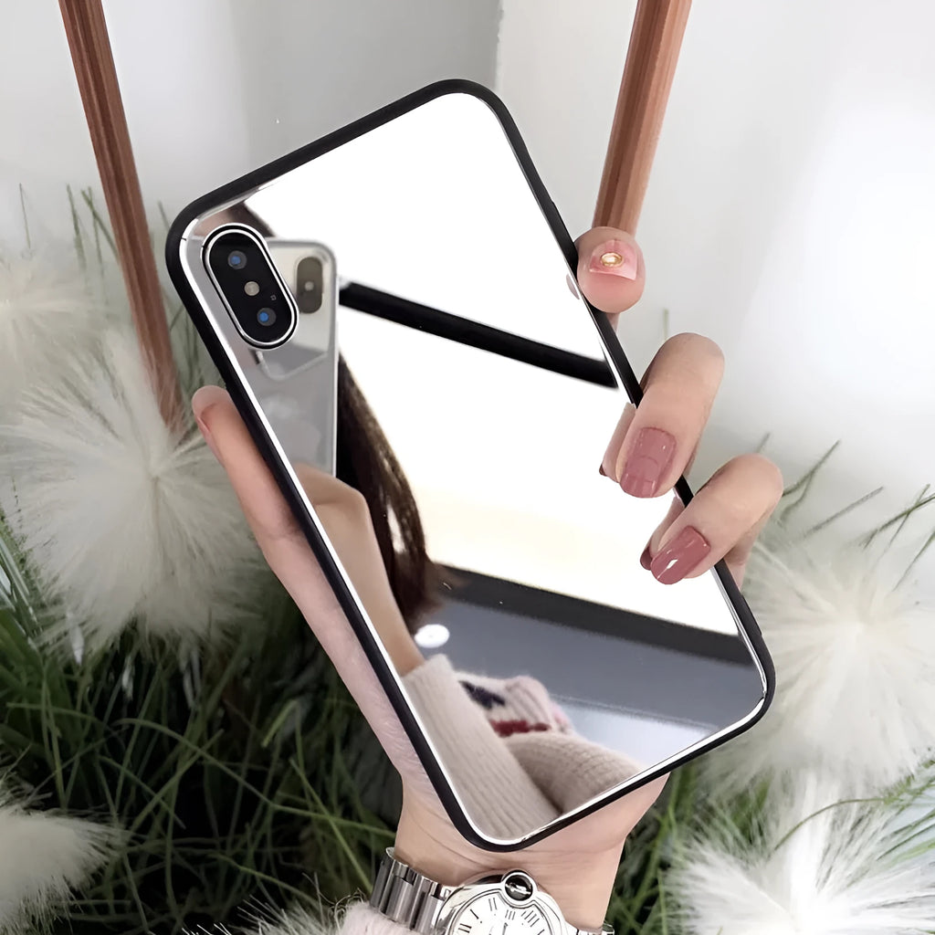 Black iPhone case with a reflective mirror panel on the back, shown fitted to an iPhone.
