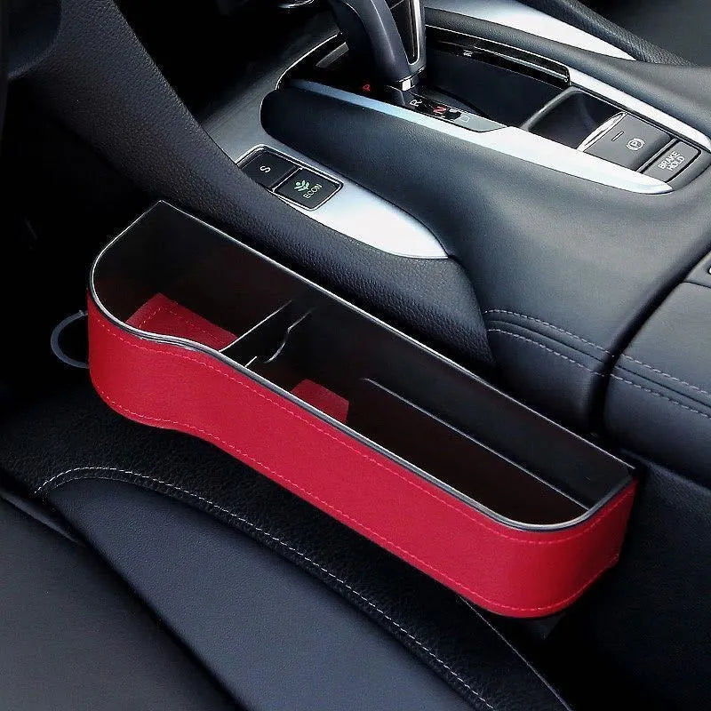PU leather car seat gap storage box in black holding a smartphone and wallet between the console and seat