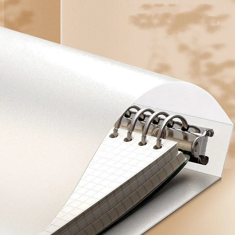 B5 hardcover notebook with lucky cat design showing binder binding for detachable pages