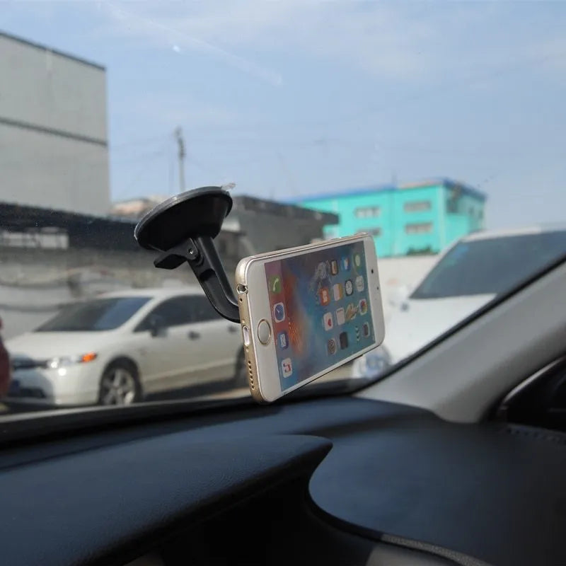 Black magnetic car phone holder with 360-degree rotation for dashboard and windshield mounting