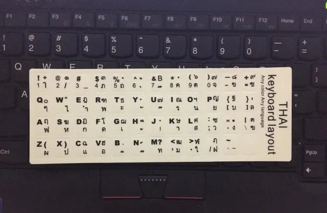Yellow glowing PVC keyboard stickers with Arabic, Thai, Hebrew, French, Italian, and German language characters