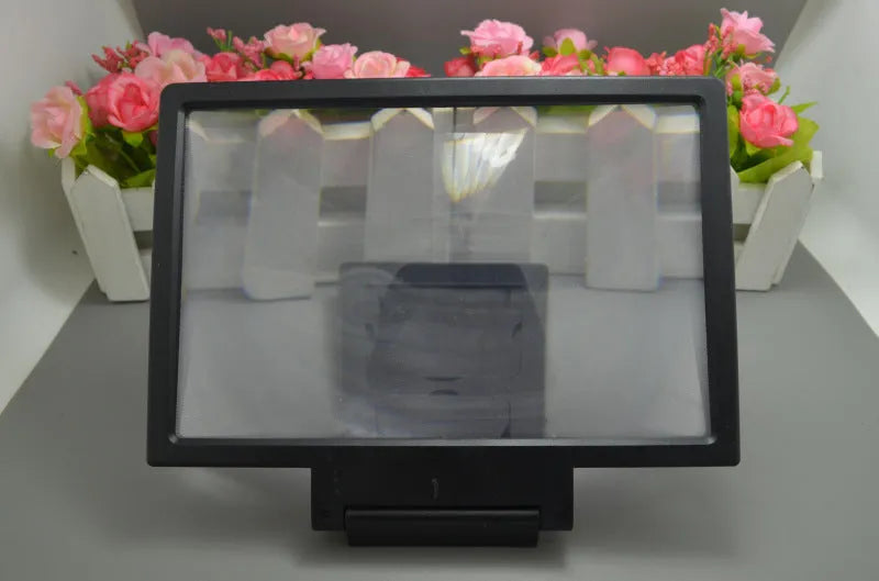 Black and white smartphone screen amplifier measuring 18cm by 12cm with protective packaging