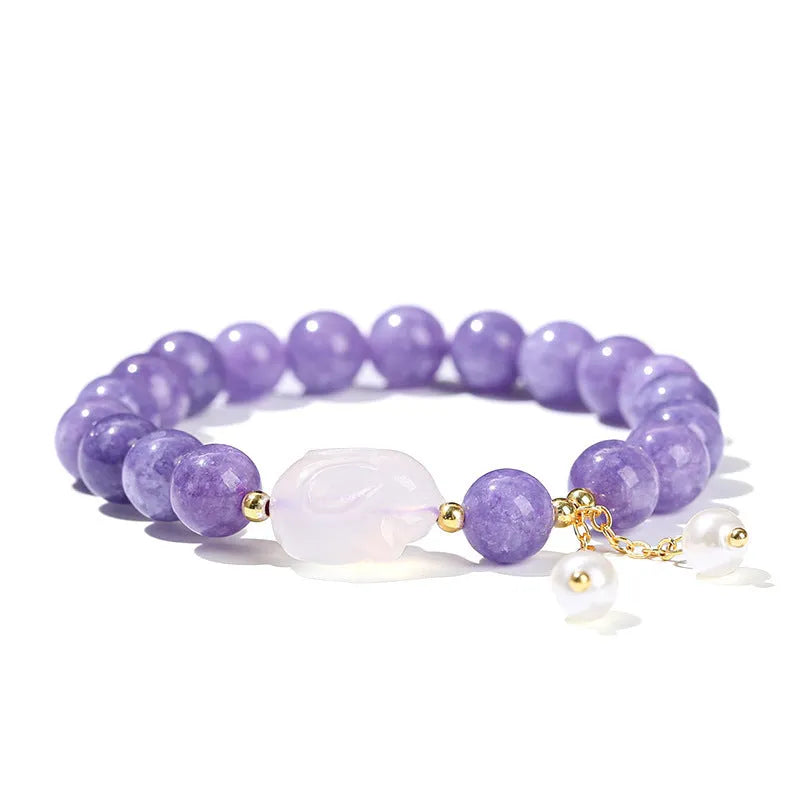 Purple aquamarine chalcedony and agate rabbit bracelet with geometric beads sized 6mm, 8mm, and 12 by 16mm.