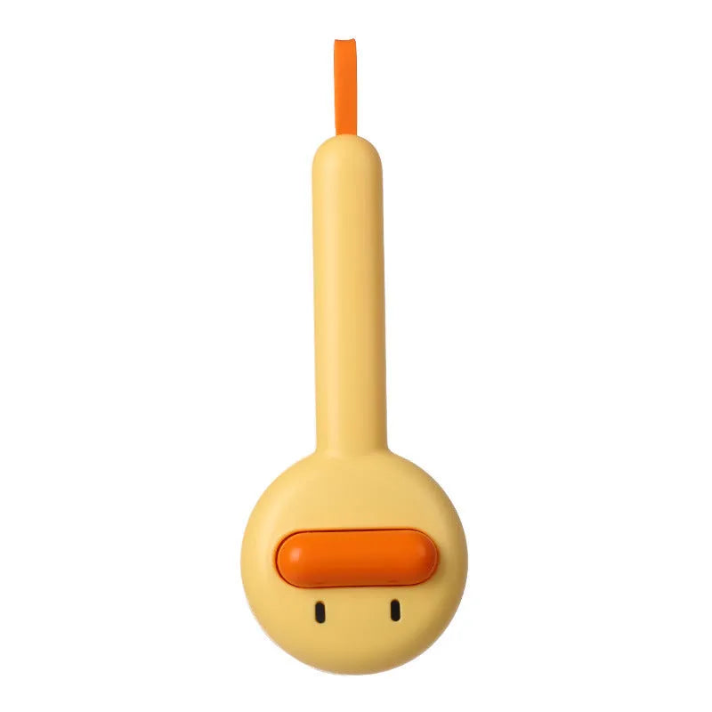 Small yellow duck-shaped pet grooming comb with needle tines for hair removal from cats and dogs.