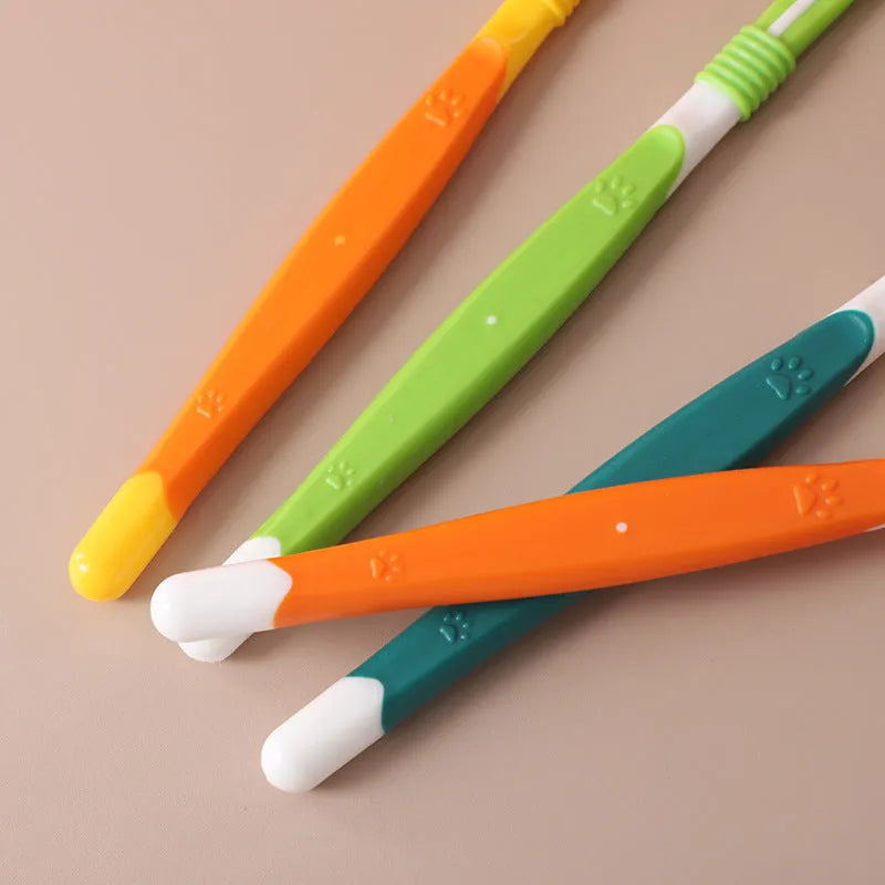 Pet toothbrush with soft nylon bristles on a plastic handle in various colour options for dogs and cats