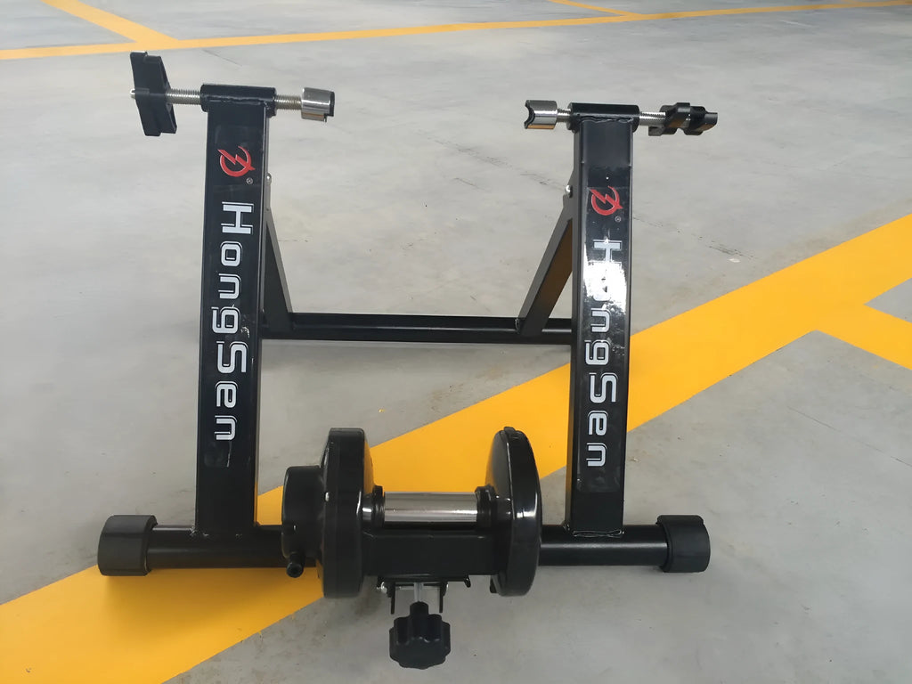 Indoor cycling training platform with magnetoresistance line control and fixed parking frame for 66-69cm bikes, black
