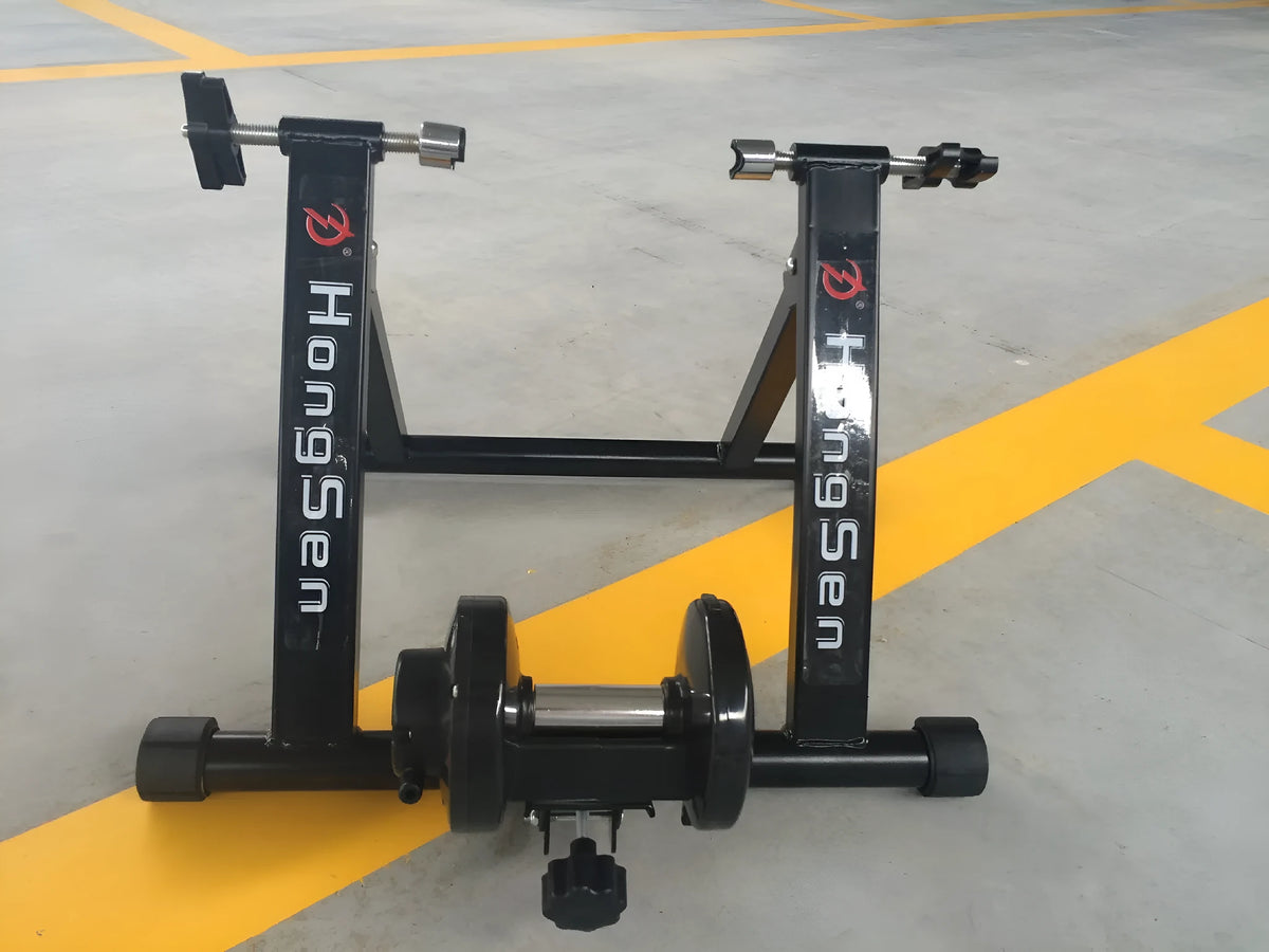 Indoor cycling training platform with magnetoresistance line control and fixed parking frame for 66-69cm bikes, black