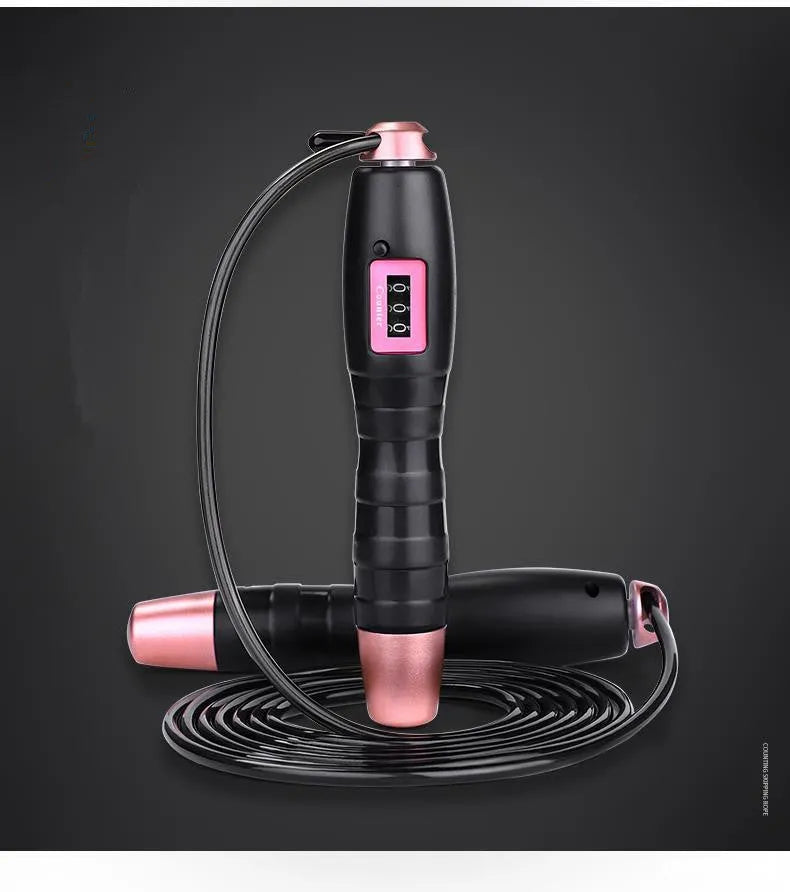 Adjustable digital skipping rope with black ABS handle and TPU coated steel cable on workout mat