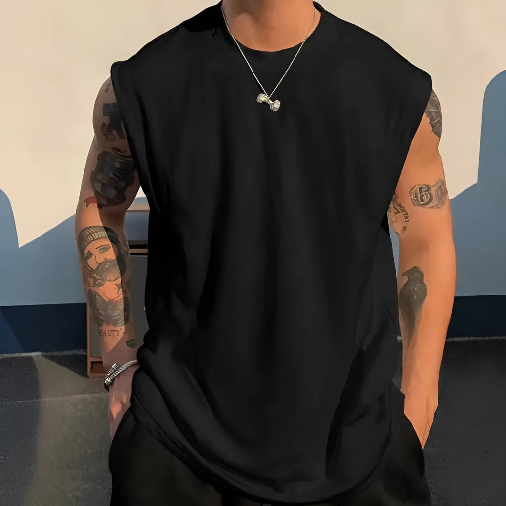 Men's loose fit cotton tank top in solid colours showing sleeveless design and straight hem