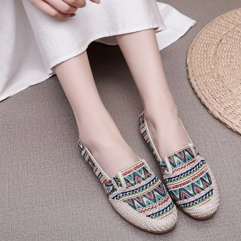 Women's flat-heel ethnic style cloth shoes in assorted colours with colour stitching and a shallow mouth design