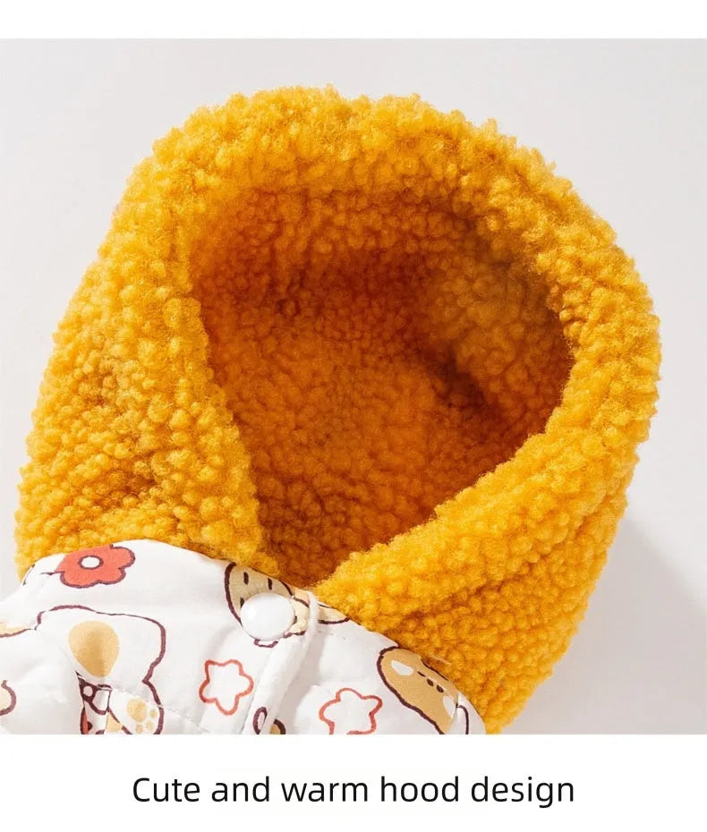 Yellow quilted cotton four-legged dog coat with sherpa hood and bear print on white background