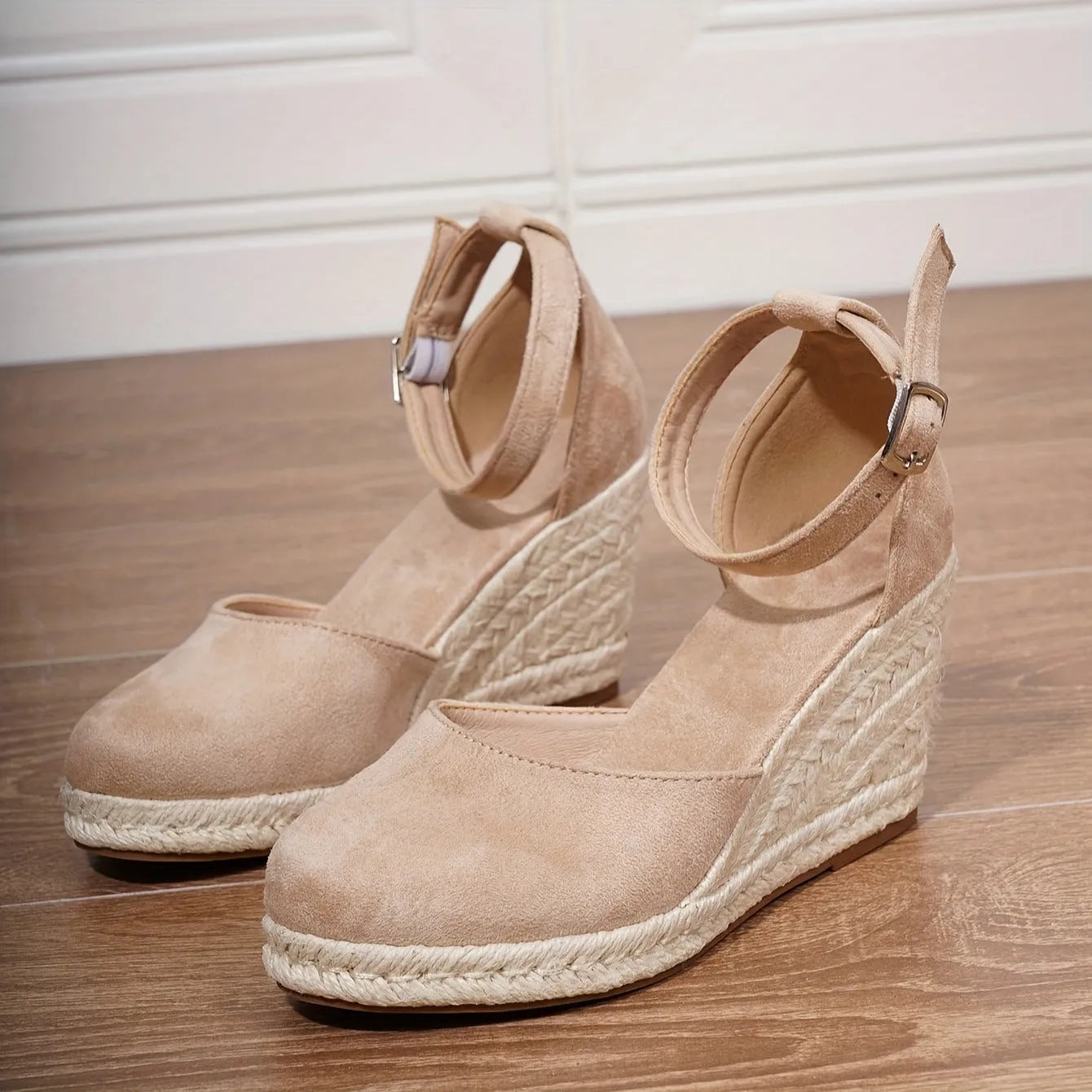 Women's apricot and black wedge sandals with suede upper and buckle closure on rubber sole