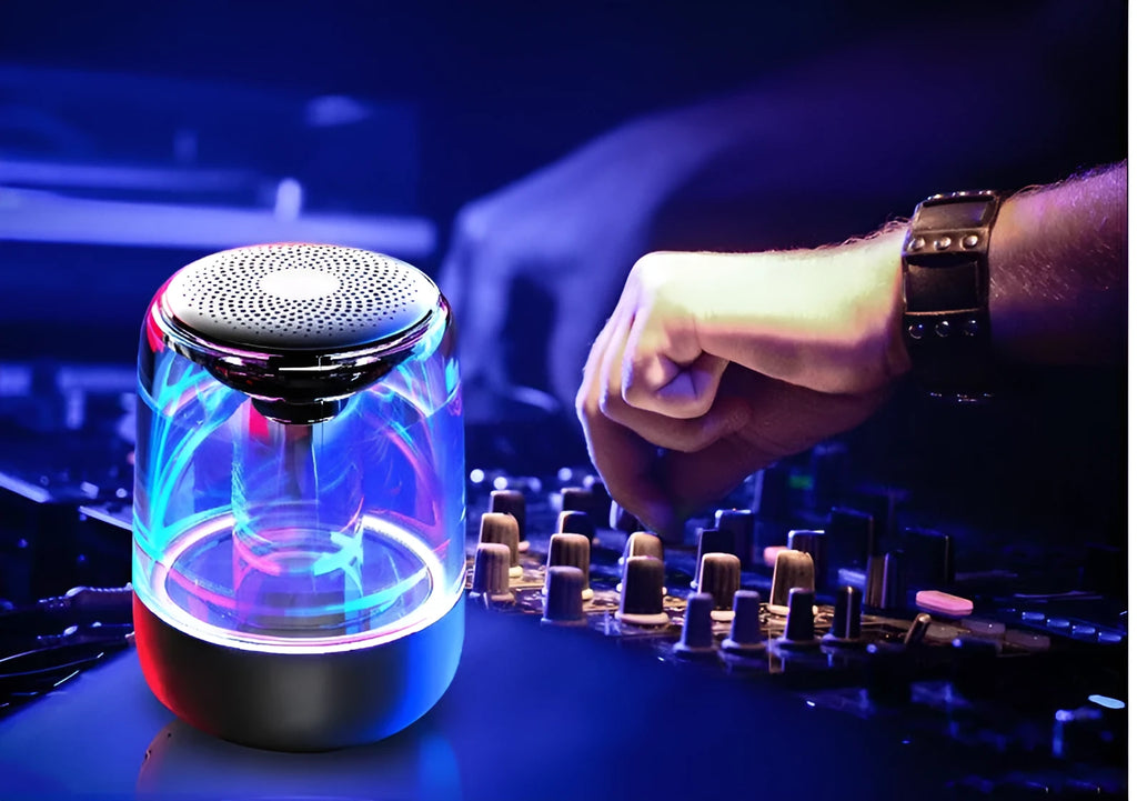 Portable Bluetooth speaker with powerful bass, variable colour LED light, compact size 90x68mm in black