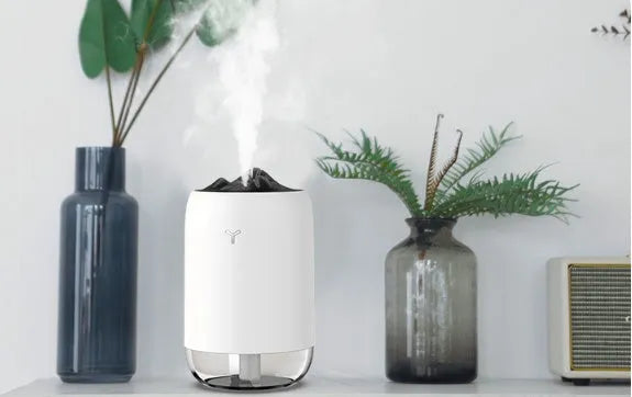 Mini USB ultrasonic humidifier 260ml with night light in turquoise green on a desk