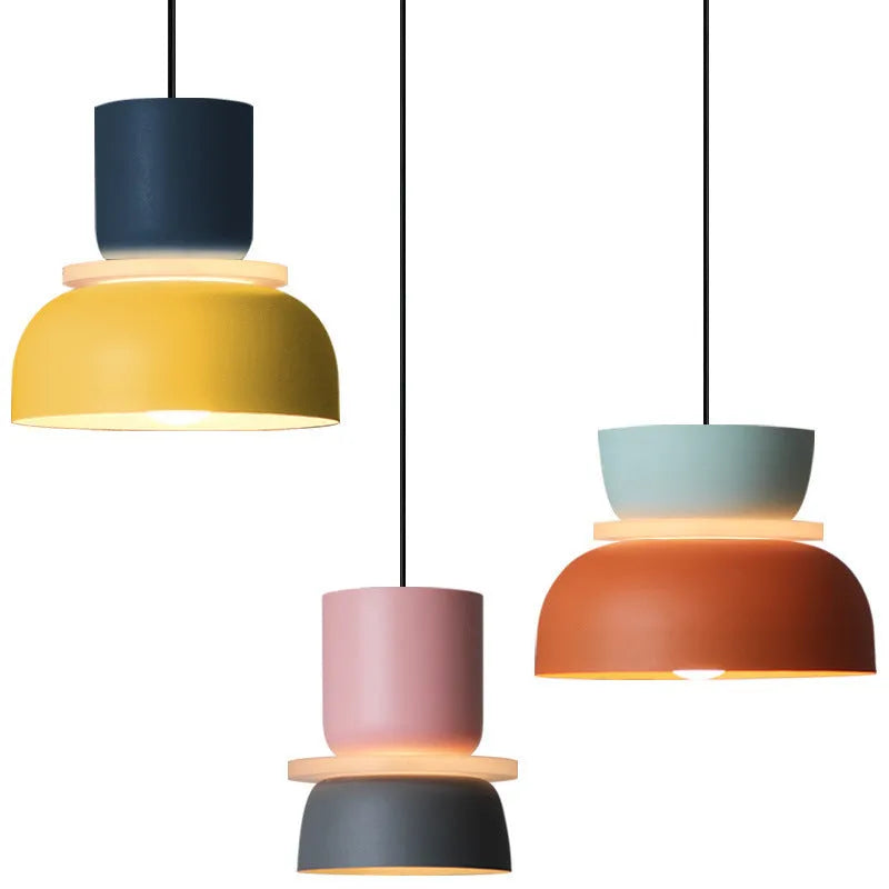 Nordic minimalist iron pendant light in a dark colour with a warm light bulb for bedroom or cafe use