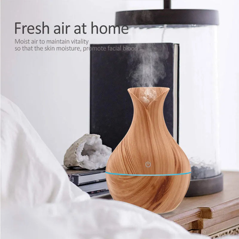Small vase humidifier with 130ml water tank in Crackle Mahogany finish, USB powered, on a wooden desk