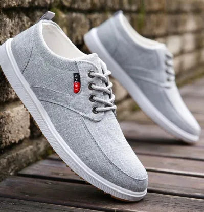 Men's lace-up canvas casual walking shoes in black with flat heel and lace-up design