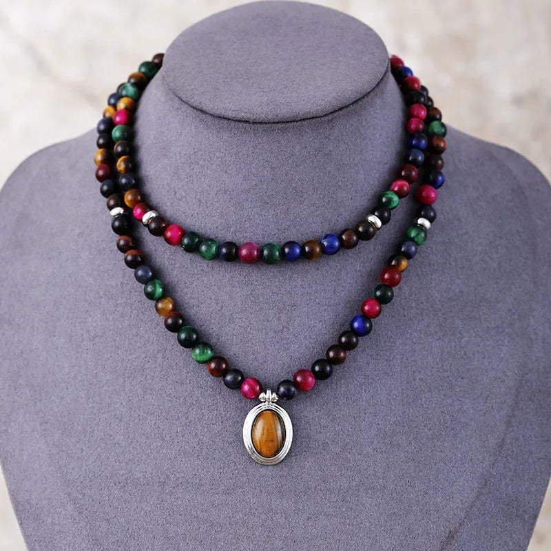 Natural stone meditation necklace with tiger eye pendants and symbolic charms on adjustable ball bead chain