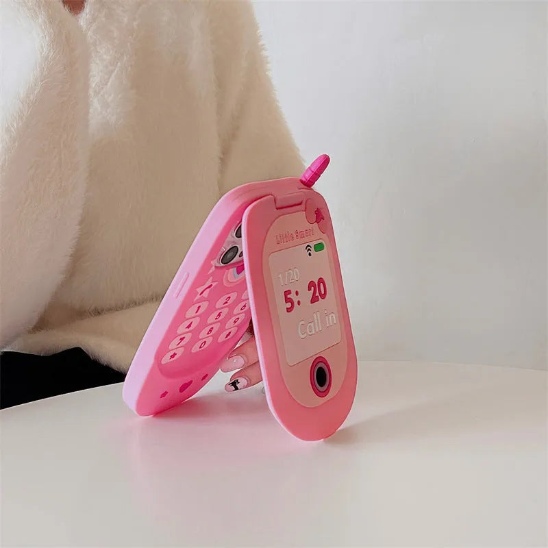 Pink silicone flip phone case with a mirror for iPhone models.
