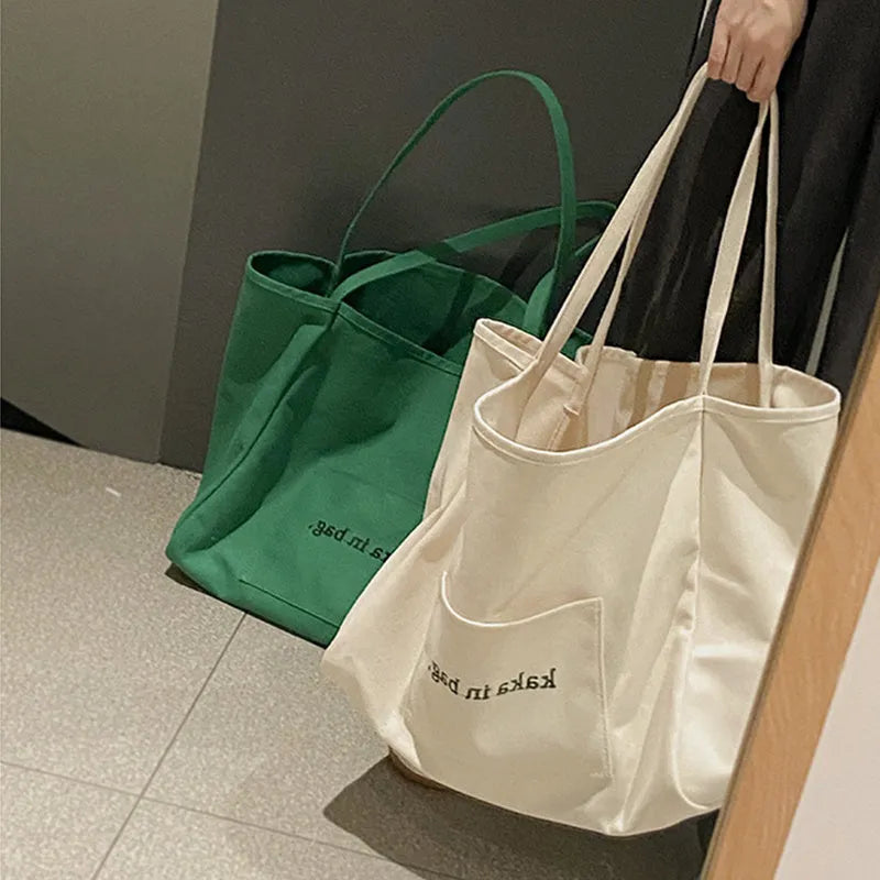 Large capacity canvas shopping tote bag in solid colour, suitable for shoulder carry