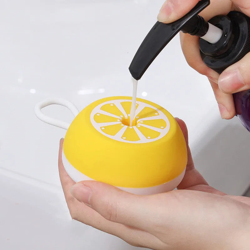 Yellow silicone pet bath brush with massage head and comb side for dog and cat grooming.