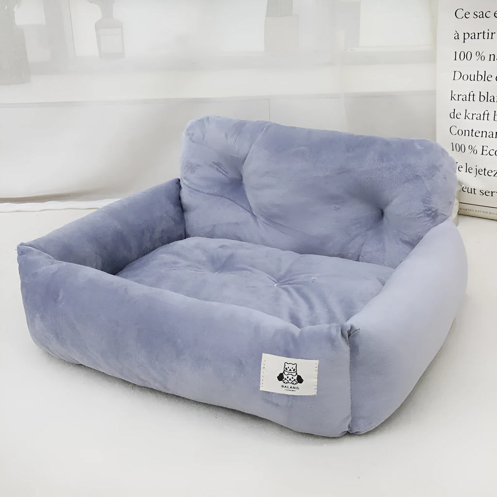 Grey and blue plaid cloth dog beds shown in two sizes for car travel.