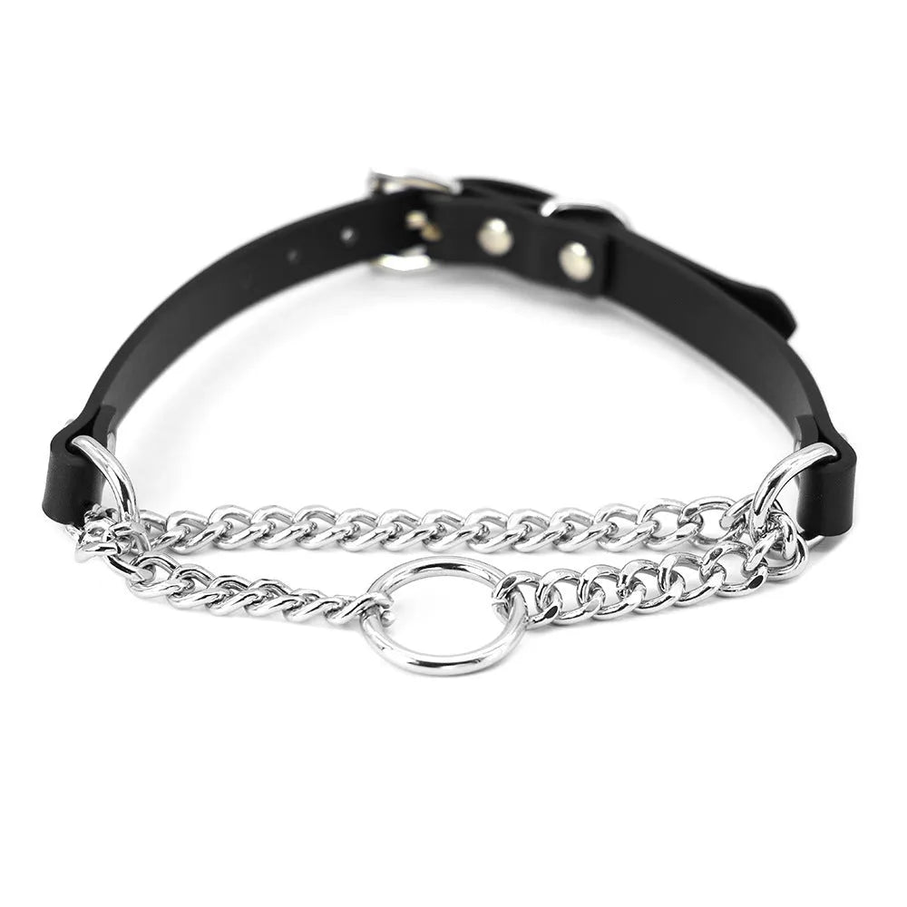 Black leather collar with chain detail and attached black leash on a dark background.