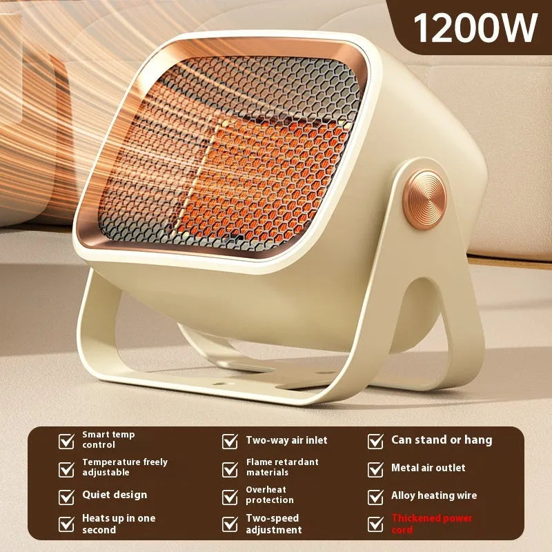 A compact grey desktop electric heater with a rotatable base on a table.