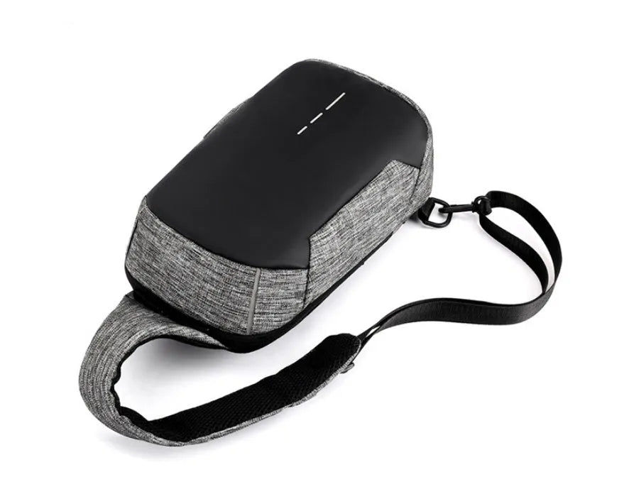 Dark blue Oxford cloth waterproof chest bag with zip and adjustable strap, shown on a person's chest.