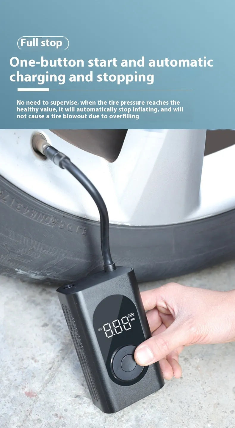 Black portable wireless tyre pump with digital display, LED flashlight, and USB cable on a grey background.