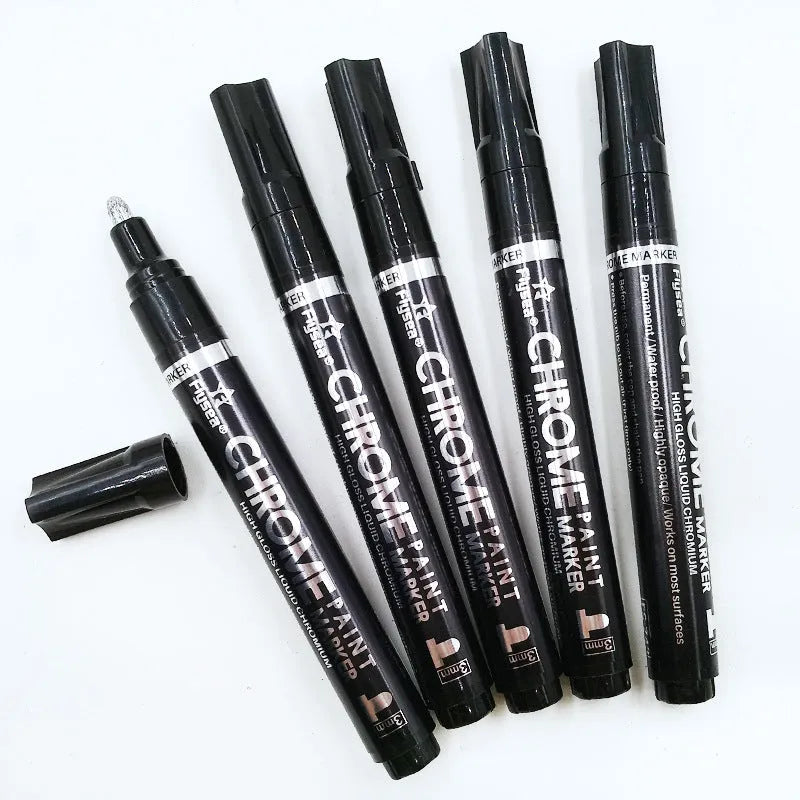 Chrome-plated reflective paint marker pen with 3.0mm tip on glass surface showing silver writing