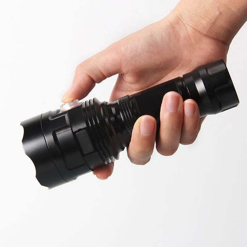 Black aluminium alloy tactical LED torch with 55mm head showing six dimming modes and USB charging port