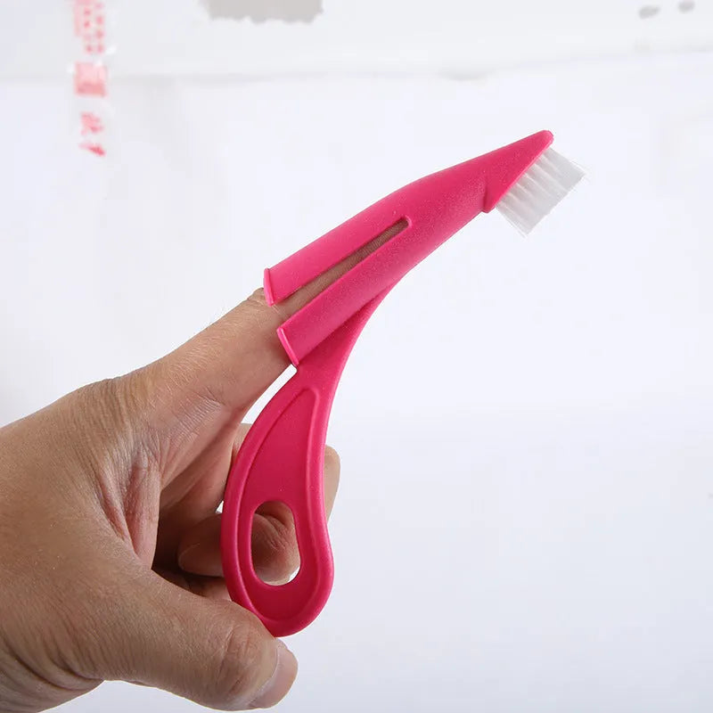 Red and white pet finger toothbrush with soft silicone bristles for cleaning dog and cat teeth