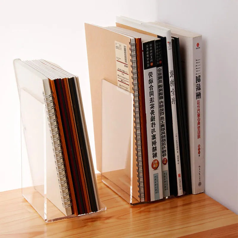 Clear transparent acrylic bookshelf holding a small stack of books on a desk.